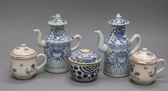 A pair of 19th century Chinese blue and white sauce jugs and covers, a pair of famille rose custard cups and covers and a Cau Mau type